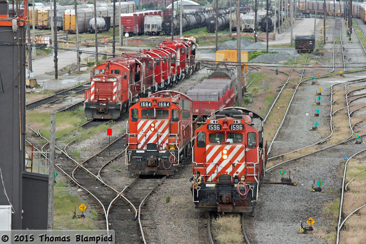 CP 1596 pauses during its switching duties at the north end of Toronto Yard. To its left, 1684 awaits its next assignment, while the power on the dead line awaits its fate.