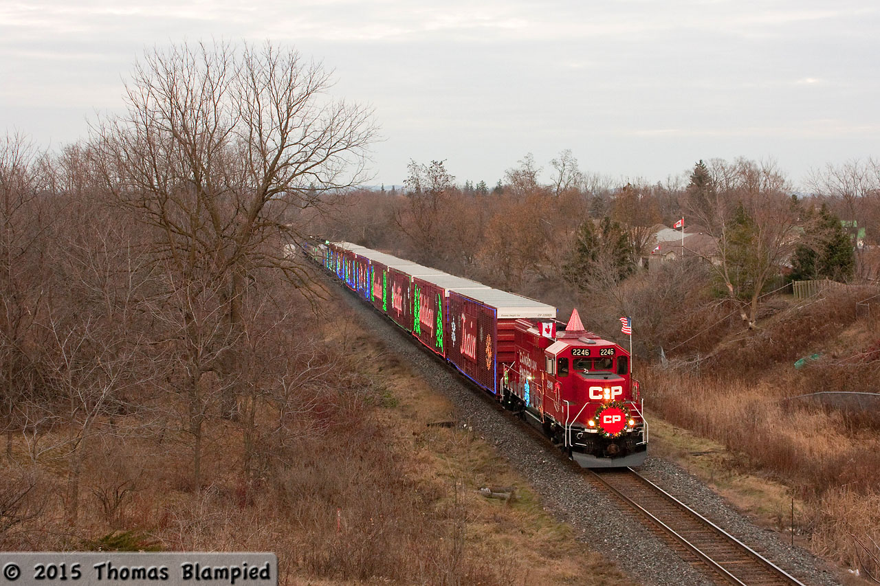 There isn't any snow on the ground, but CP is still bringing the holiday spirit to communities across Canada and the United States. Having completed a Holiday Train show in Bowmanville, CP 2246 accelerates out of town on its way to the next show in Oshawa.