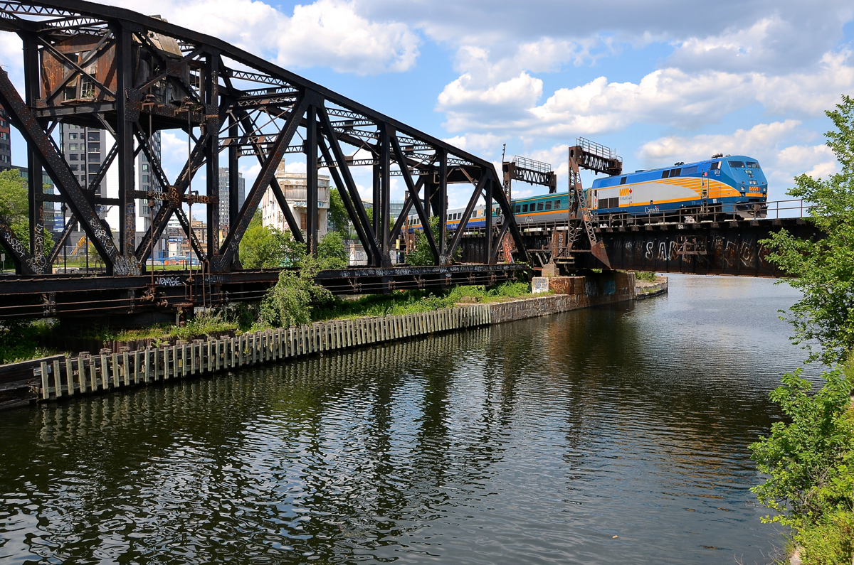 VIA 919 pushes a deadhead movement towards Montreal's Central Station.