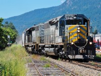 The old CPR track to Sicamous is in the foreground as GTW nos.5946 & 5945 head out of downtown Armstrong in charge of a northbound freight.