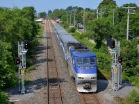 <b>Approaching Cedar Park station.</b> AMT 51 approaches Cedar Park station with AMT 1330 pushing. It is passing a fairly new set of signals.