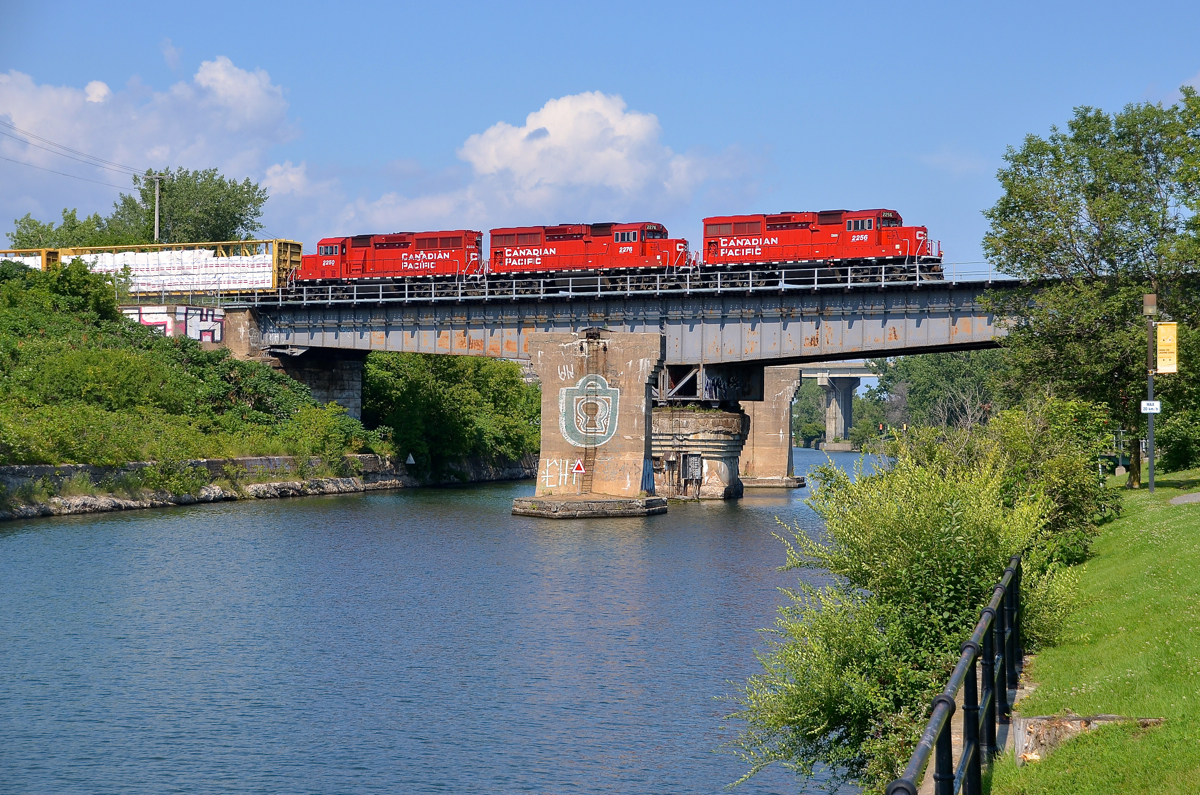 A trio of GP20C-ECO's (CP 2256, CP 2276 & CP 2250) lead a long CP 318 over the Lachine canal on a scorching afternoon. It will head to Iberville and interchange with the CMQ.