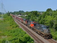 CN 372 has a BC Rail leader and another mid-train (BCOL 4646, CN 2600, CN 2406 & BCOL 4651 DPU) as it passes through Pointe-Claire, past MP 13 of the Kingston sub.