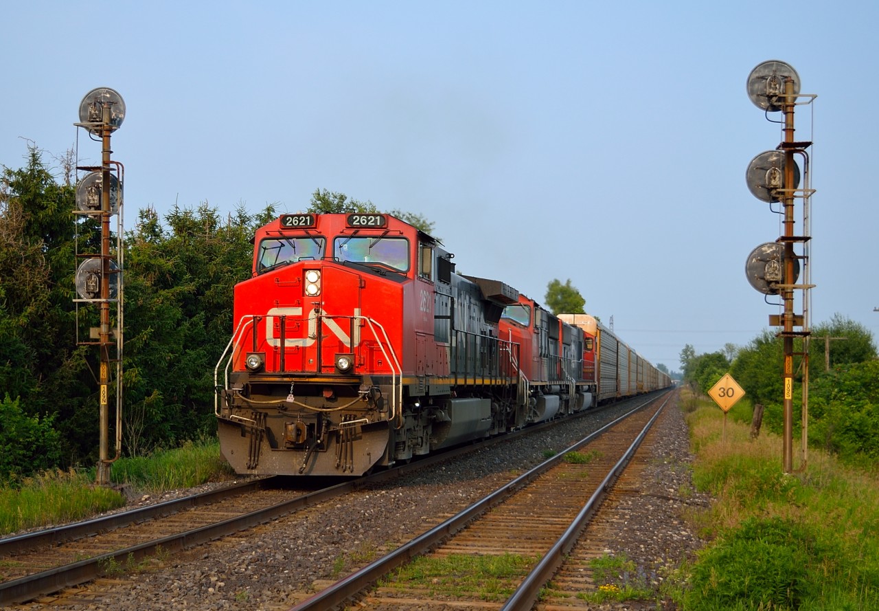 CN 399 splits the signals at Copetown West on a sunny July evening with a trio of CN units providing the power for a good sized train.