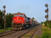 CN 399 splits the signals at Copetown West on a sunny July evening with a trio of CN units providing the power for a good sized train.