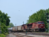 CP 551 has CP 8729 & CP 9837 and three buffer cars as it passes CP's Lasalle Yard. The American crew ran out of hours before getting to Montreal, so a Canadian crew was taxied down to St-Mathieu to bring the train in.