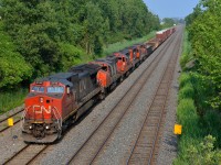 <b>A short transfer with lots of power.</b> CN 527 is a Montreal area Southwark Yard-Taschereau Yard transfer that often runs over 100 cars, but not today. Today's CN 527 into Taschereau had 5 units (CN 2142, CN 4803, CN 7075, CN 7015 & CN 4114) and maybe 25 cars.