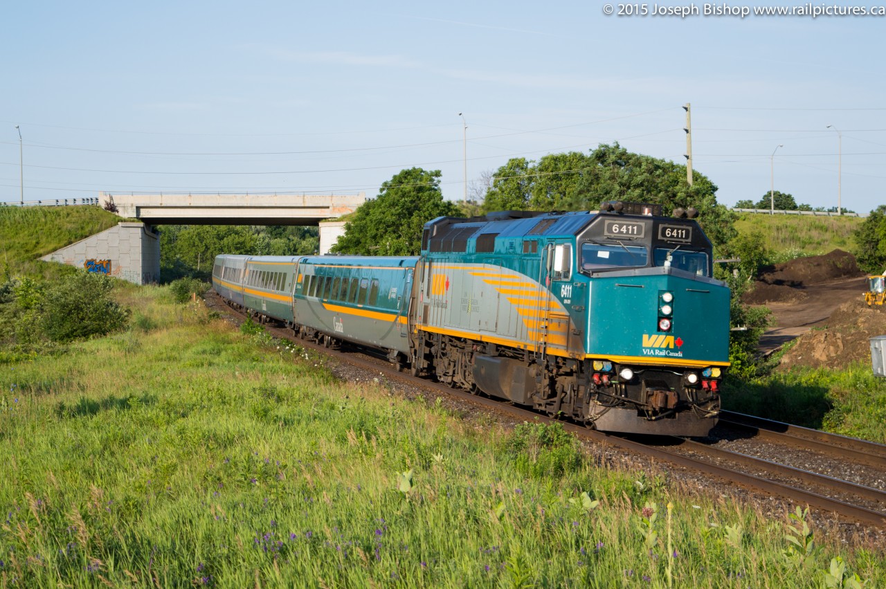 VIA 6411 leans into the curve at Garden Ave just outside of Brantford with 6 LRC coaches trailing.  They have just departed Brantford and are on their way towards their next station stop at Aldershot.  I was on my way into work and saw the headlight at Masseys and couldn't pass up the sweet morning light for this train.