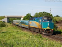 VIA 6411 leans into the curve at Garden Ave just outside of Brantford with 6 LRC coaches trailing.  They have just departed Brantford and are on their way towards their next station stop at Aldershot.  I was on my way into work and saw the headlight at Masseys and couldn't pass up the sweet morning light for this train.