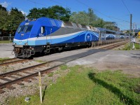 <b>Back to diesel mode.</b> AMT 1354 arrived at Mont-Royal Station in electric mode with its pantograph up, but while making its station stop it dropped its pantograph and is now departing the station in diesel mode. It is AMT 1207, which is on its way to Mascouche, on AMT's newest commuter line.
