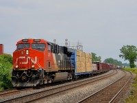<b>A late CN 369.</b> CN 369 is through Dorval with 150 cars and CN 2888 at the head end and another ES44AC mid-train (CN 2870). It is passing through here about 5-6 hours later than normal due to the CN derailment on the Kingston sub on Saturday.