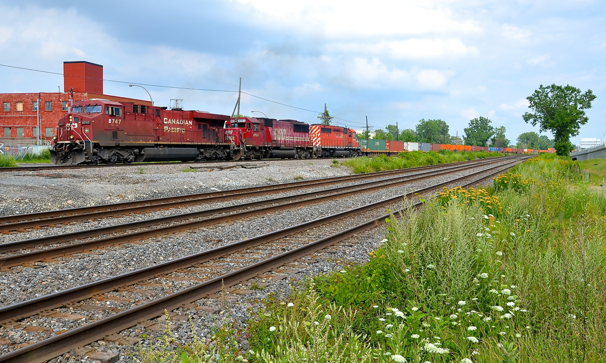 Some EMD standard cabs trailing. CP 143 has ES44AC CP 8747 leading two older standard cabs (SD60 SOO 6053 & SD40-2 CP 5957) as it leaves Dorval now that the conductor is on board. The last two units arrived in Montreal early in the morning on CP 132, the eastbound Expressway.