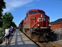 CP 253 is blasting through Lasalle station during the middle of the morning commuter rush, as anxious commuters await the arrival of AMT 84, already about 10 minutes late at this point (it would arrive 20 minutes late). Power is CP 8808 & CP 9822.