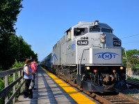 AMT 84 is arriving at Lasalle station during the morning rush hour with ex-GO Transit F59PH AMT 1342 as power.