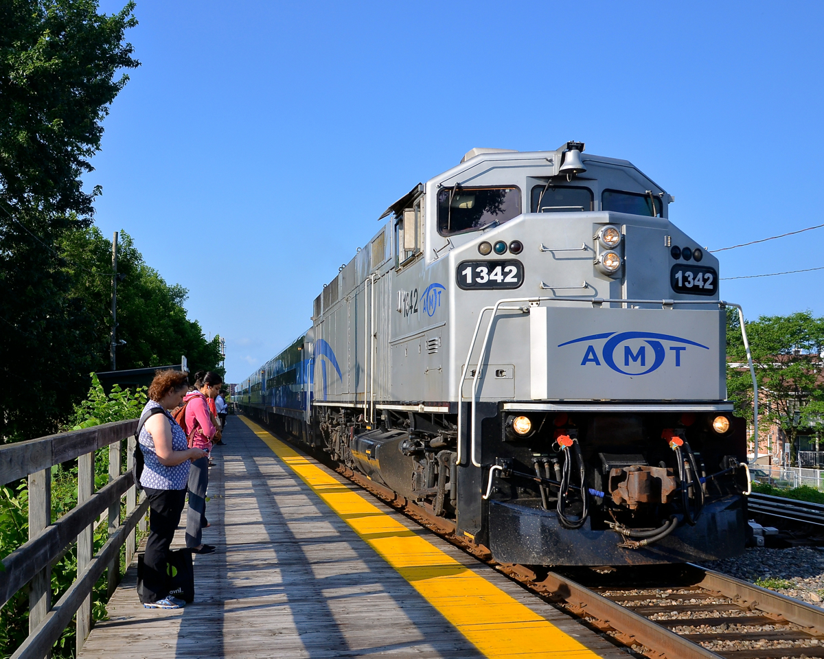 AMT 84 is arriving at Lasalle station during the morning rush hour with ex-GO Transit F59PH AMT 1342 as power.