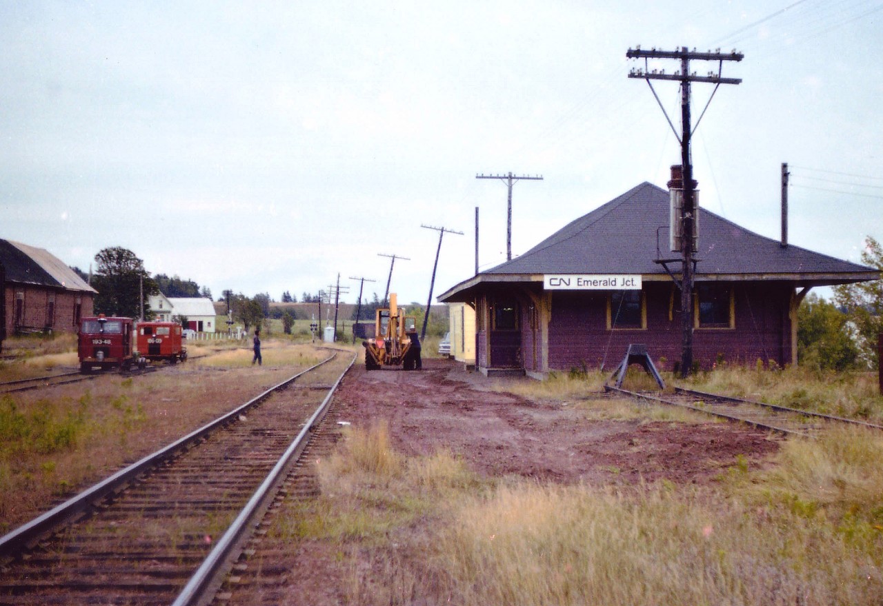 Yes, it has been over 25 years since the trains left Prince Edward Island. And once upon a time the Emerald Junction station was a busy little place. In this 1977 view we see the Speeders have just come in (coffee time?) and the track of the Kensington Subdivision looks well used. Behind me a quarter mile is the junction of the Borden Sub., which leads to the ferry over to New Brunswick. I understand this station has been restored and preserved, for what purpose I have not heard. Too bad none of the railroad itself was saved.