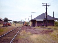 Yes, it has been over 25 years since the trains left Prince Edward Island. And once upon a time the Emerald Junction station was a busy little place. In this 1977 view we see the Speeders have just come in (coffee time?) and the track of the Kensington Subdivision looks well used. Behind me a quarter mile is the junction of the Borden Sub., which leads to the ferry over to New Brunswick. I understand this station has been restored and preserved, for what purpose I have not heard. Too bad none of the railroad itself was saved.