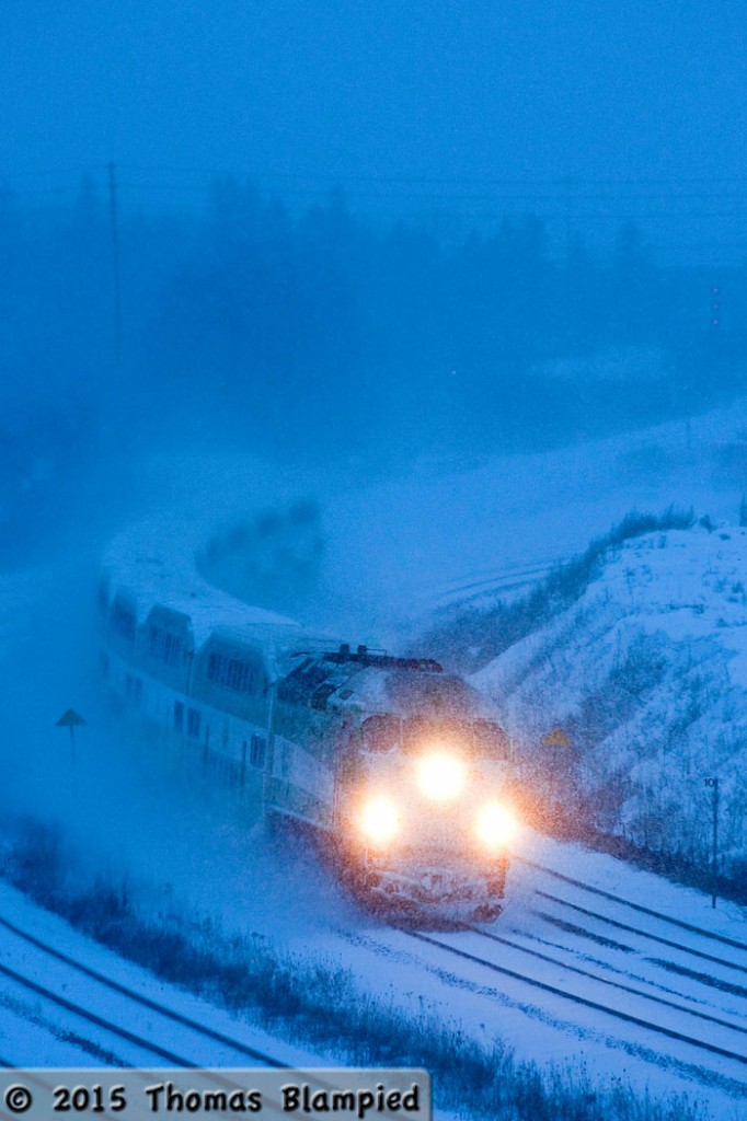 GO 920 battles through the snow at dusk on a cold winter evening.