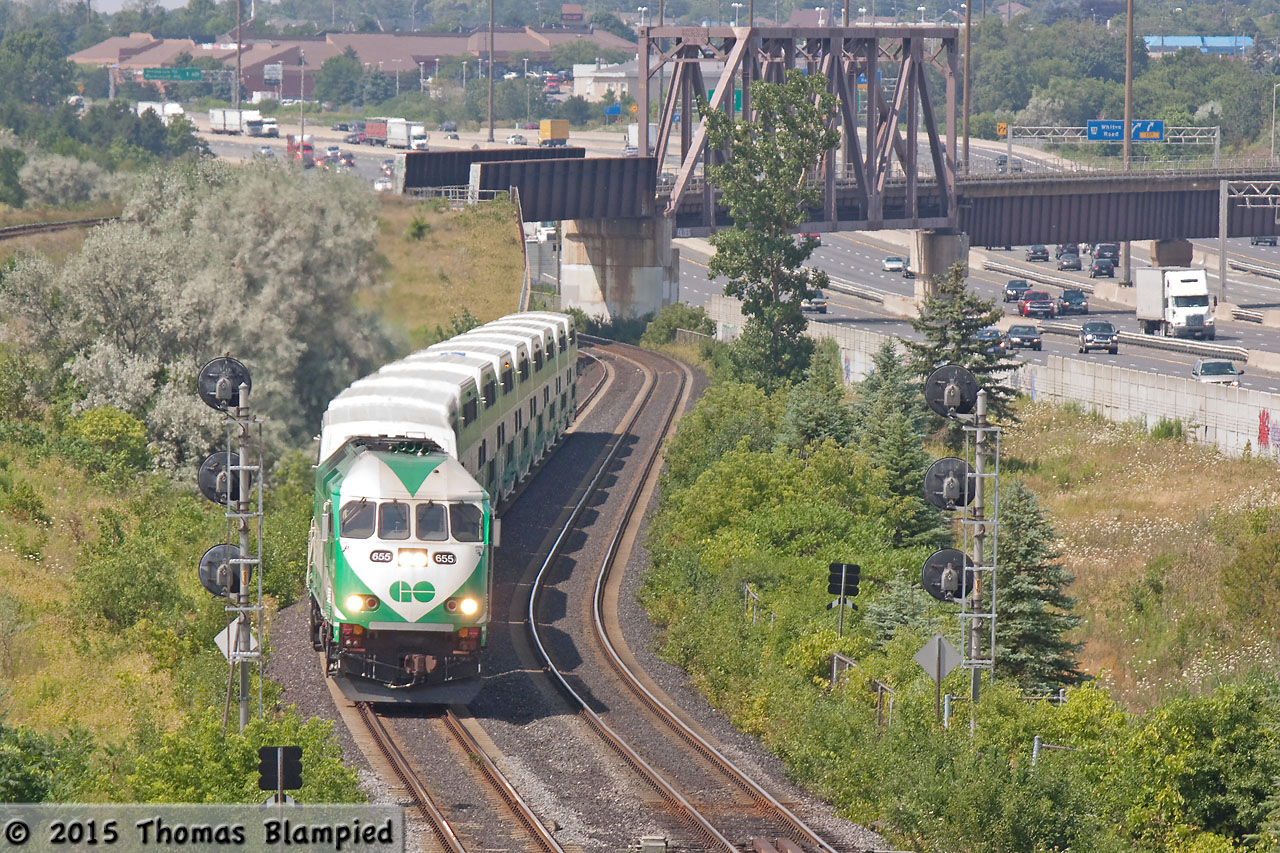 GO 655 approaches Pickering with an Oshawa-bound Lakeshore East train after passing under the iconic CN bridge over Highway 401.