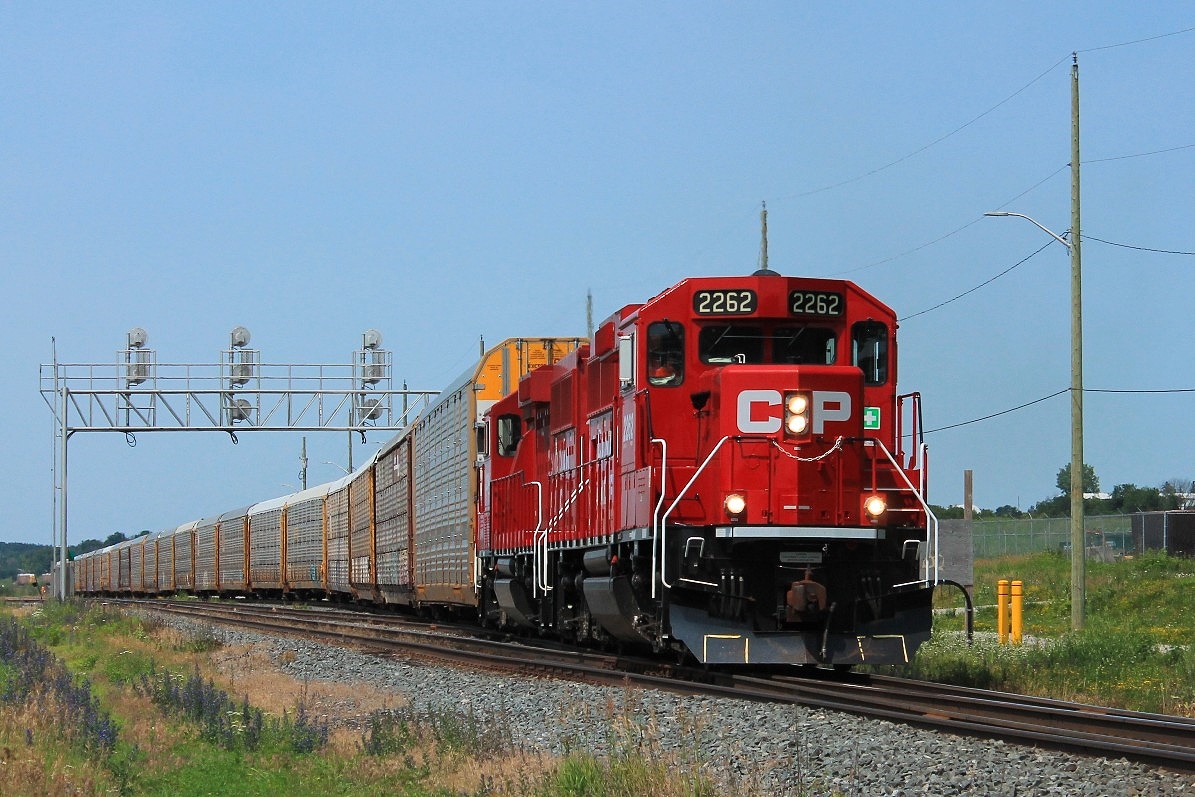 CP 2262 and 2254 switching at the east end of the yard where they hold up traffic at the crossing before running round the train and heading west to Pender.