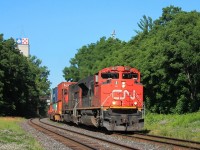 9:49 and 8837 and 5652 lead a long 148 Intermodal around the curve to the west of the station before powering up the bank.