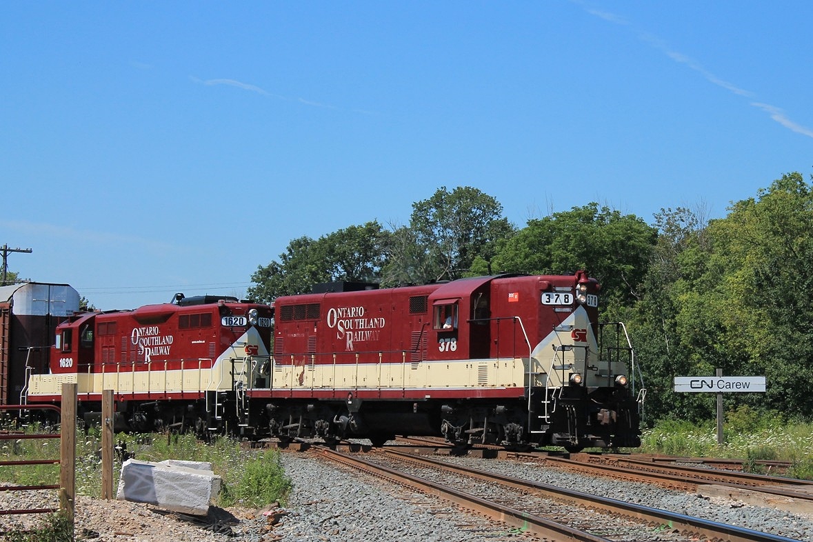 OSR 378 and 1620 take a train of loaded Autoracks over the Dundas main at CN Carew and up to the CP yard.