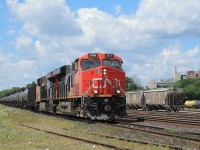 A long eastbound freight under the power of two AC's 2866 and 2896 on the southtrack. In the background is Brantford hospital that watches over the west end of the yard.