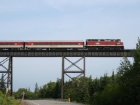 The Agawa Canyon Tour Train rolls out onto the 800 foot long, 100 foot high trestle over the Bellevue valley.