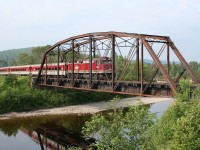The northbound Agawa Canyon Tour Train crosses the old truss bridge over the Goulais River at Searchmont.