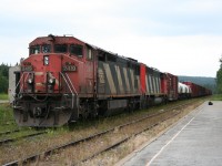 CN train 571 idles on a yard track at Hawk Junction as the passenger train will get the first turn to go north. Today's train is 28 cars of mostly interchange traffic for Canadian Pacific at Franz and empty pulpwood flatcars.