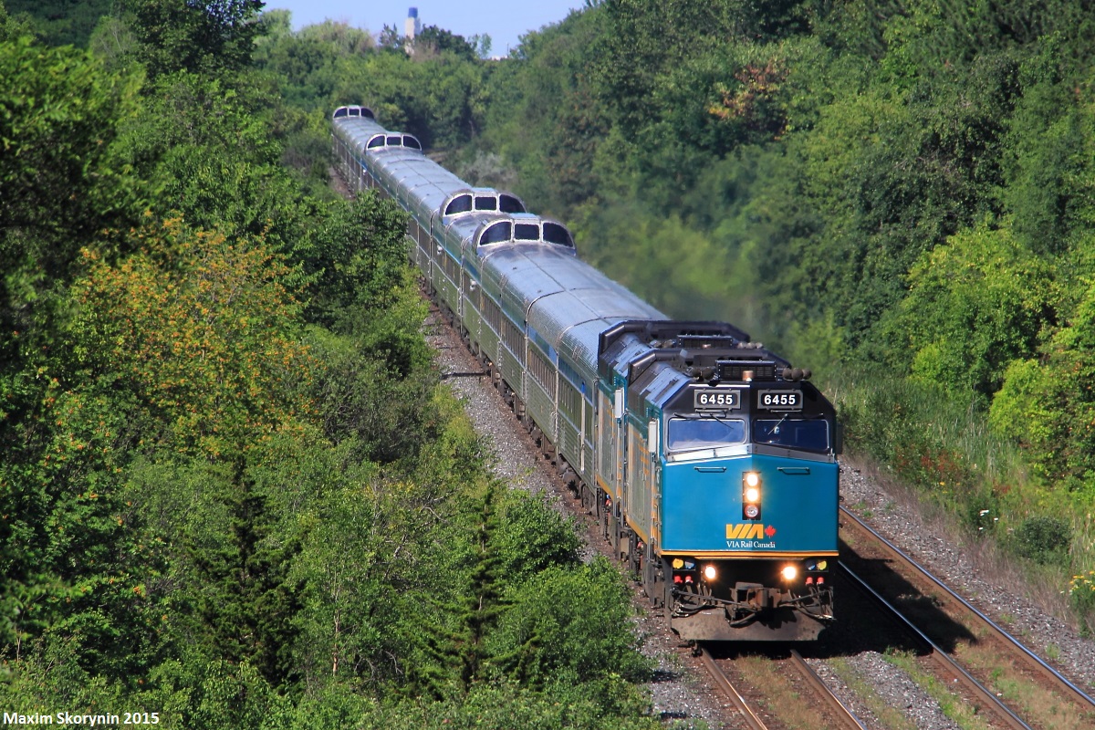 2 rebuilt F40PH-3 locomotive's are in the lead of trans-continental VIA #1, also known as 'The Canadian', which crosses Canada from Toronto en-route to Vancouver. This shot is usually very rare to come across as #1 usually departs Toronto (about 45 minutes away for #1) at 22:00, making it pass through this location on the York Subdivision at nearly 23:00. However, since the last days inbound VIA 02 got in so late (past 22:00 for those wondering), #01 had to be rescheduled for a 08:30 departure out of Toronto the next morning.

Here they are doing 45mp/h on the York Sub hurrying to make up at least some of their delayed time into Vancouver.