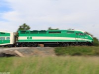 Northbound GO train #805 charges past the Langstaff Rd crossing, with MPI MP40PH-3C locomotive #610 pushing on the tail end at mile 15.10 of the CN Newmarket Subdivision. The Newmarket Subdivision used to be owned by the Canadian National Railway Company, but GO Transit had purchased the line. However, CN still operates the line while GO Transit owns it, with about 1 freight train each day which usually runs during the night to avoid distributions with GO train's. Construction has started of a 2nd track all the way to Barrie to run hourly service, which is scheduled to be completed by 2020.