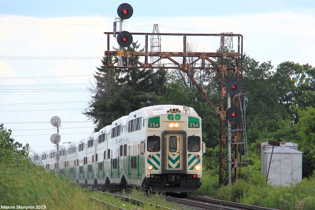 Cabcar #254 charges GO Transit commuter train 803 northbound past the old signal bridge at CN Snider South. GO 803 is the 2nd of the daily 7 northbound evening GO Trains from downtown Toronto to Barrie, on GO Transit's Barrie Line. With vador replacements looming nearby, I had to get this shot, and while I was hoping for an F59PH leading, this will do just fine.