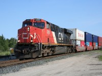 CN hotshot intermodal train no. 101 slows to a stop at Hornepayne for a crew change. ES44DC 2283 is backed up by distributed power units ES44DC 2331 in the mid-train position and C44-9CW 2671 on the tail end. Total train length was approximately 190 platforms.