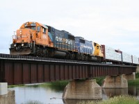 Ontario Northland train no. 516 (Hearst to Kapuskasing) rolls across the Mattawishquia River bridge departing the French-Canadian town of Hearst with 9 cars bound for points south or east via Cochrane.