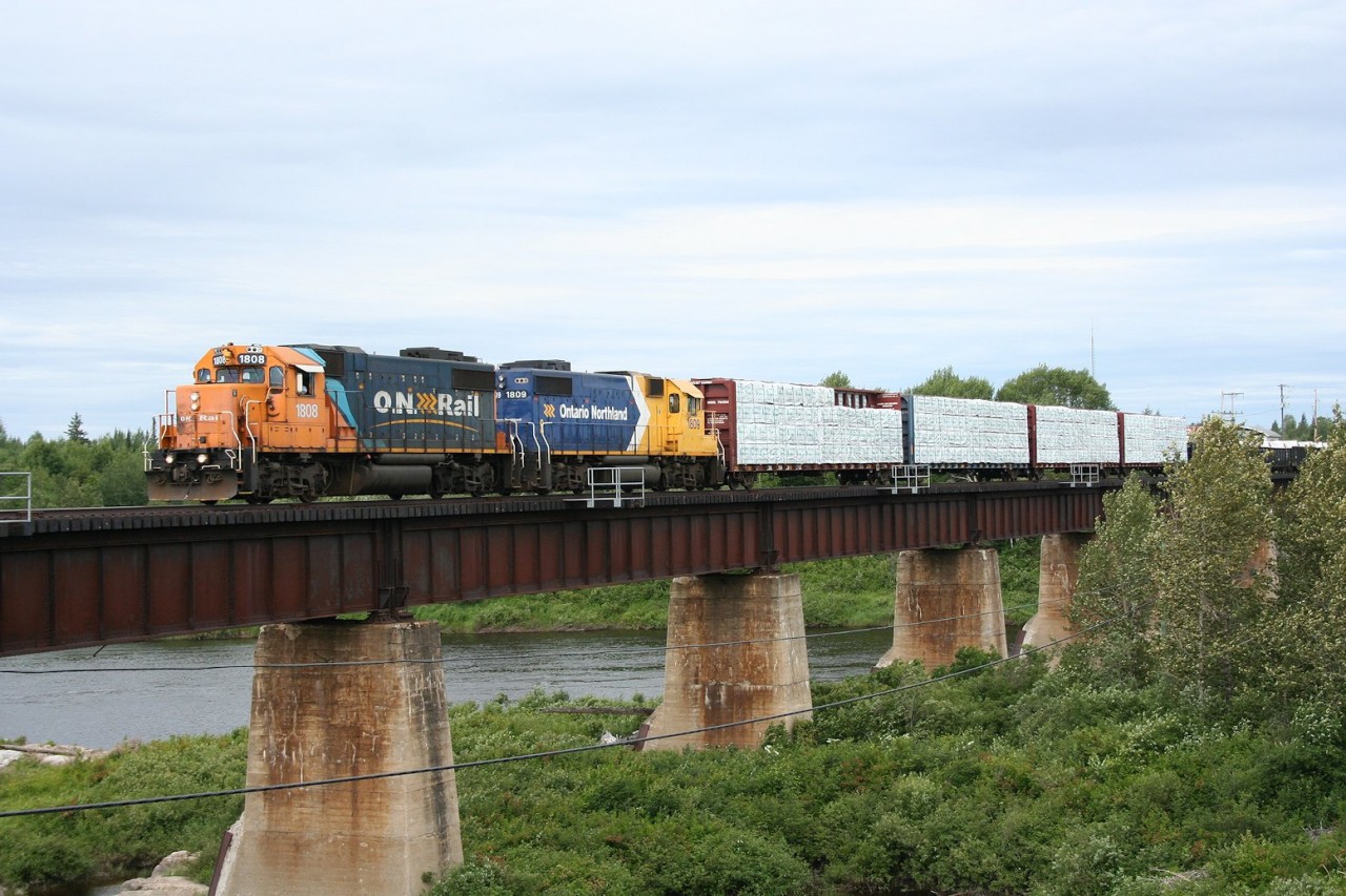 Ontario Northland train no. 516 (Hearst to Kapuskasing) crosses the Missinaibi River in Mattice, Ontario.
