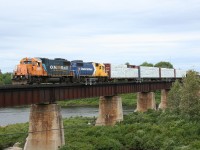 Ontario Northland train no. 516 (Hearst to Kapuskasing) crosses the Missinaibi River in Mattice, Ontario.