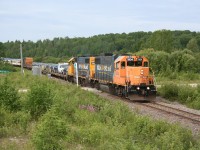 The northbound 'Polar Bear Express', Ontario Northland's unique tourist excursion/regular passenger service/mixed train approaches milepost 5.0 on the Island Falls subdivision on the beginning of it's daily trip to the remote community of Moosonee.