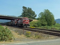 Westbound CP coal train passing under the south approach to Mission highway Bridge.
