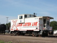 The BNML caboose, BN 12580 sits in the BNSF Winnipeg Yard waiting to begin a hard day of work as BNSF 2694 prepares a short train to start.