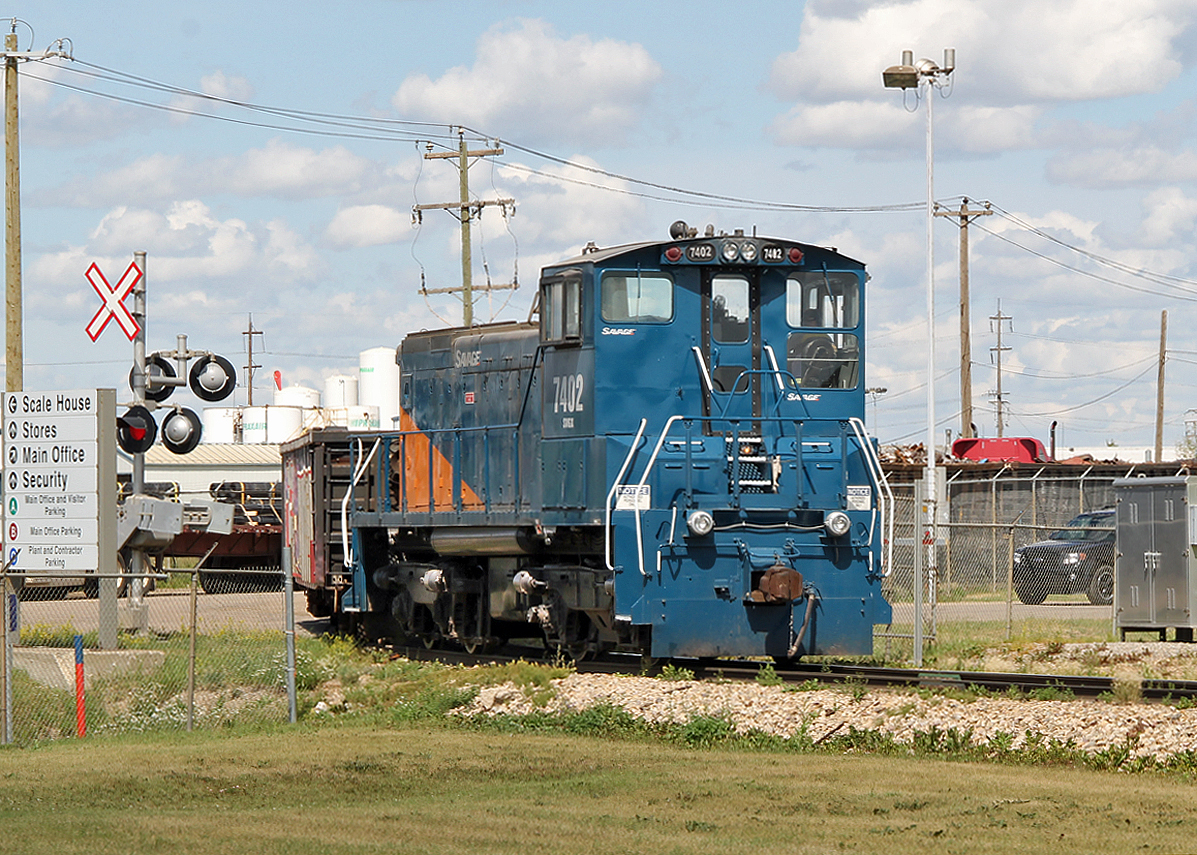 Savage Services Corporation MP15 # 7402 is seen switching cars at The Altasteel Works on 34st in Edmonton.