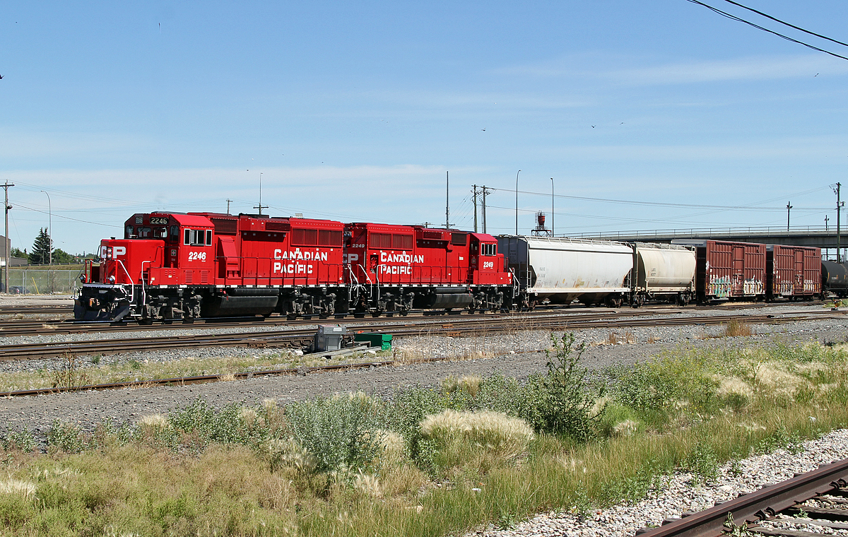 A pair of GP20C-ECO locomotives, CP 2246 and 2249 switch cars at the west end of CP's Alyth Yard in Calgary.