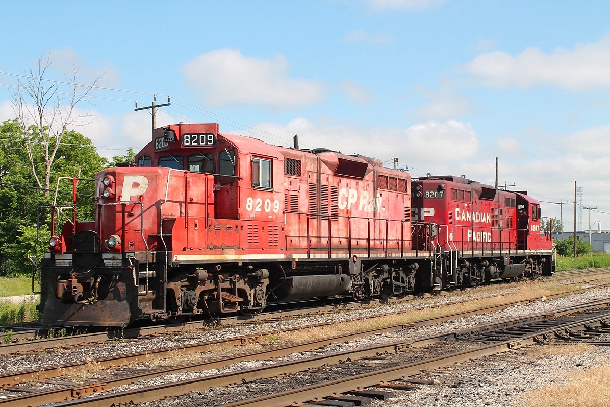 A pair of geeps race east towards Pender to start work at Toyota.