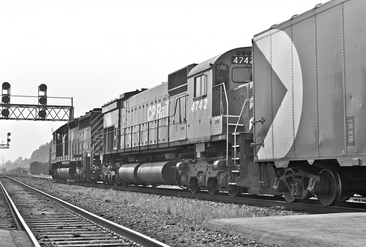 SD40 #5559 and M-636 #4742 storm past Leaside Station.  Fall, 1975.