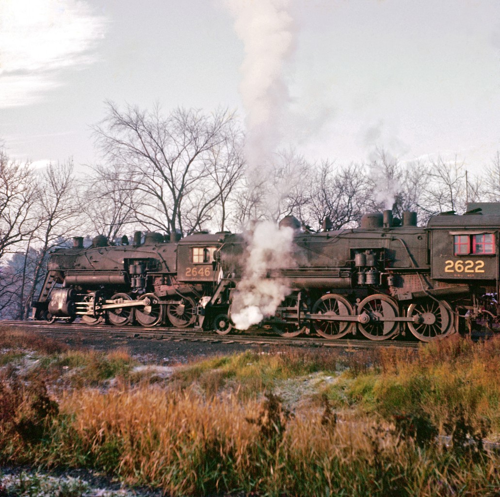 Two Consolidation-types (2-8-0) are shown on a fall day near Pembroke.


#2646 was built in 1908, while #2622 arrived two years later.  Both would meet the torch in 1958.