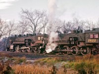 Two Consolidation-types (2-8-0) are shown on a fall day near Pembroke.
<br />
<br />
#2646 was built in 1908, while #2622 arrived two years later.  Both would meet the torch in 1958.
