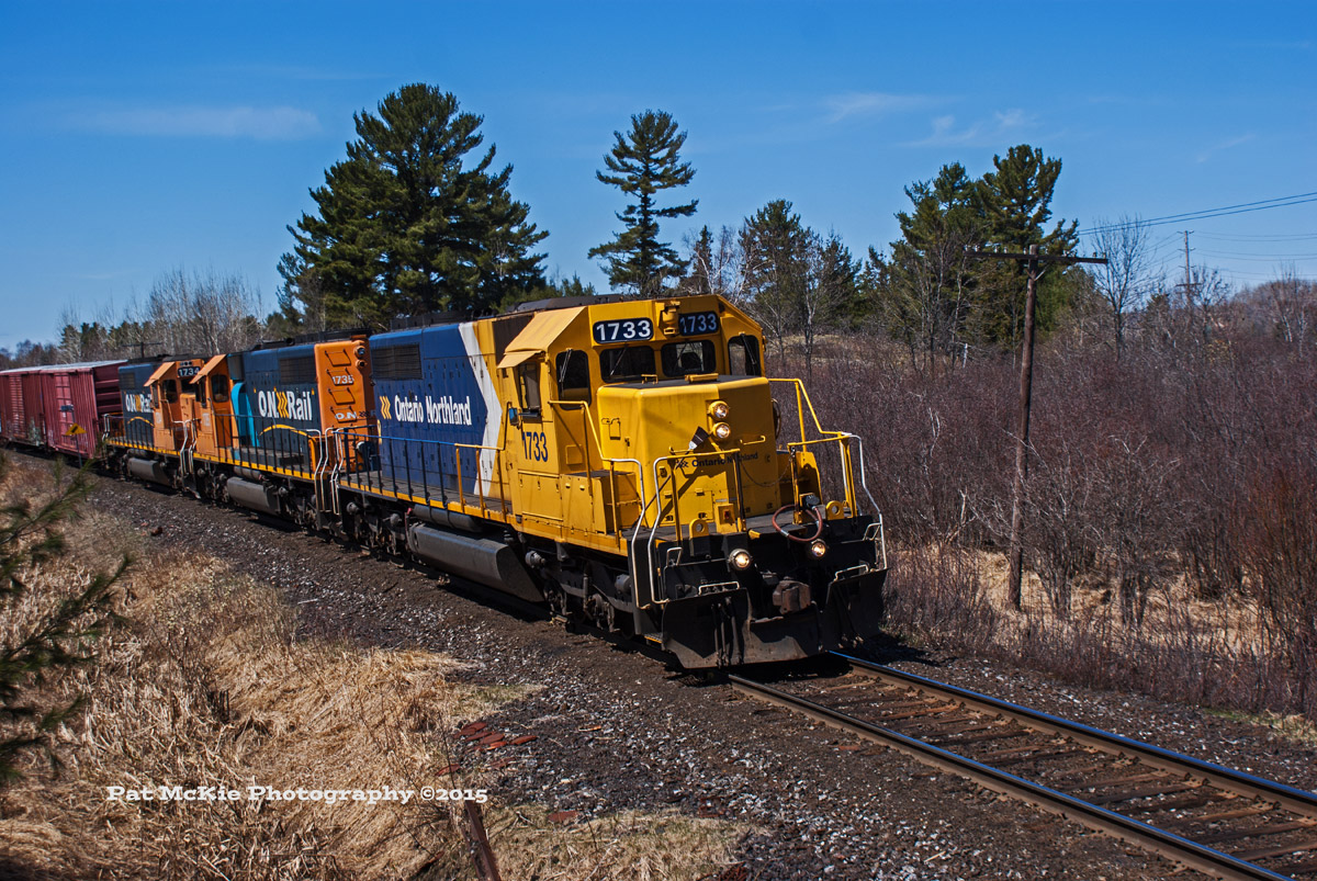 Ontario Northland 214 rolls on to the CN newmarket sub as the crew drops a string of cars arriving from Northern Ontario.