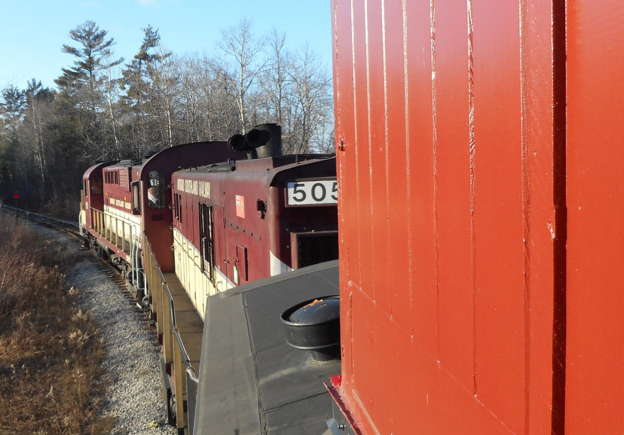 Leaning out of the cupola window of CPR 436994, OSR 181 and 505 shove the van (caboose), baggage car CNR 60337, and 4 cars south from the switchback north of Woodlawn Road to the industrial spurs. The caboose and baggage car are owned by the Guelph Historical Railway Association (GHRA). To see a photo of the train at the start of the move at Chemtura where the caboose was stored, click here: http://www.railpictures.ca/?attachment_id=17271 The GHRA is currently restoring these two pieces of rolling stock, and we are looking for new members. Anyone wishing to get involved come to a meeting. The second Monday of each month at the Co-operators, 130 Macdonell Street. 7:30PM-9:30PM. All are welcome. Next meeting is on Monday, August 10, 2015.