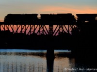 A peaceful silence is broken as the sound of growling GEVO's and steel girders resonate across the Speed River. CP train 255 is hustling through Galt, the engines growling as the hogger notches up to tackle the grade to Orrs lake. Below a few birds take flight, fearful of the noise from above, but we don't mind, do we :)<br><br>For the photographers - This photo is a combination of two techniques - a pan shot, AND a silhouette at the same time.  I haven't really had the opportunity to try this since (You need really low light!) and now it's your turn to judge. Let me know what you think :) What photographic challenge have you done (show us!). If you wish to see someone try something - what would that be?<br><br>Photo data: ISO 200, 1/40,  125mm, f/3.