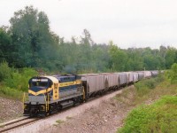 Trillium Rwy began life in Niagara as the Port Colborne Harbour Railway, and is but 3 months into its' existence when this photo was taken. The ALCO C-425 was the "start-up" power, having come from the New York & Lake Erie Rwy and appropriate decals for the PCHR slapped on the flanks. The locomotive was returned to the NYLE in 2001 and currently the unit, now in Delaware-Lackawanna paint, has operated out of the D-L in Scranton, PA since its' arrival there in  2007. The image here is of the train southward into "The Port" having just worked the WH yard, which was the principal yard for PCHR at the time, about 3.5 track-miles back.